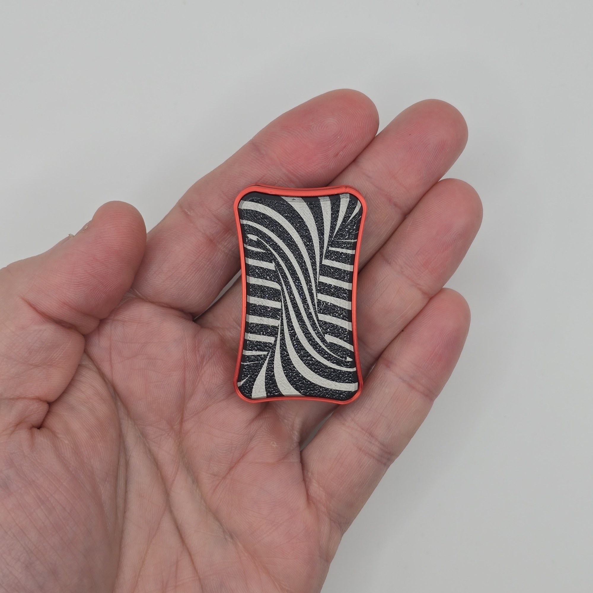 Vortex Slider, in hand scale